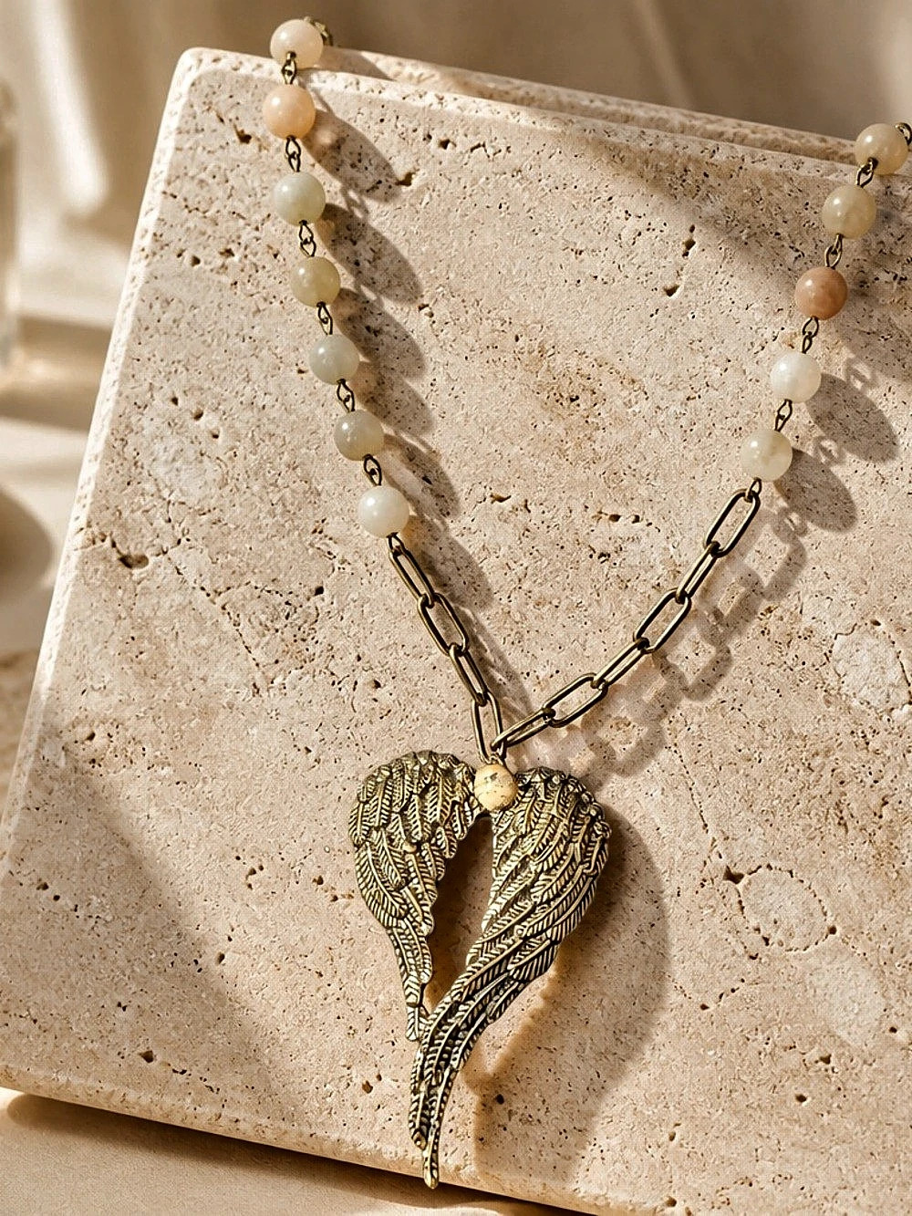 Angel Wing Pendant on Natural Stone Beaded Necklace in blue, cream and antique b